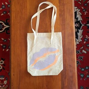 Nordstrom canvas bag, cream color with purple and orange lip imprint beauty bag